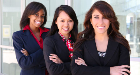 three young female business women