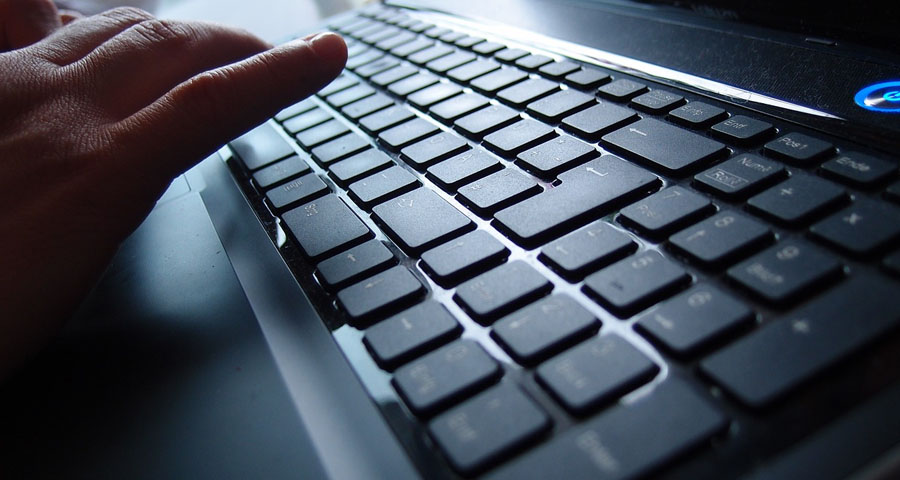 closeup of hand on computer keyboard