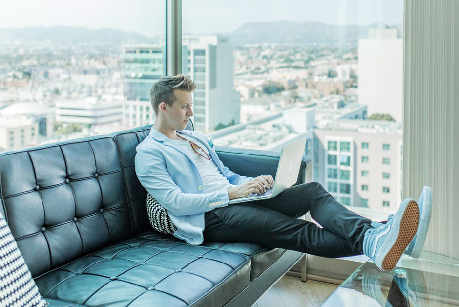 business man working remotely with view of city in backgroud
